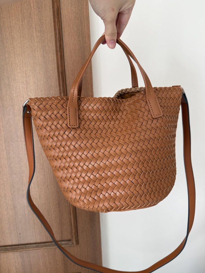 Brown Woven Leather Tote Bag with Shoulder Strap (Category: Tote Bags) located in Baguio. Submitted by p-finds (Listing ID 1460321405, Image 2). Description: - Cute brown woven tote bag - Top handles - Interior zippered pocket - Plenty of space inside - Nice leather texture - Great for everyday use.