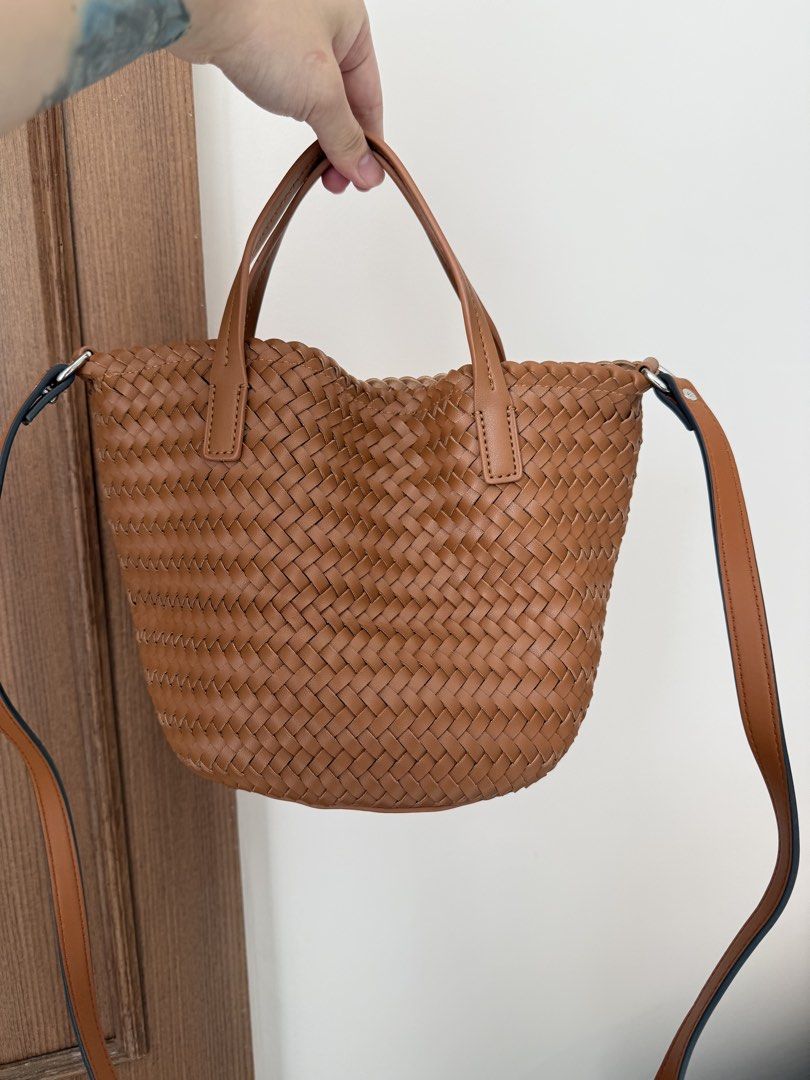 Brown Woven Leather Tote Bag with Shoulder Strap (Category: Tote Bags) located in Baguio. Submitted by p-finds (Listing ID 1460321405, Image 1). Description: - Cute brown woven tote bag - Top handles - Interior zippered pocket - Plenty of space inside - Nice leather texture - Great for everyday use.