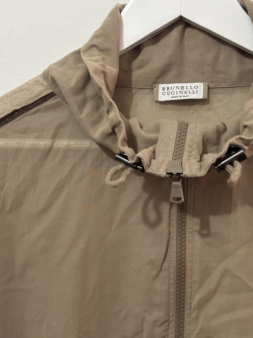 Brunello Cucinelli (Category: Coats, Jackets and Outerwear) located in Manila. Submitted by kingblaize (Listing ID 1460492834, Image 2). Description: beige Brunello Cucinelli lightweight zip-up jacket featuring dark contrast piping along the shoulders and sleeves..
