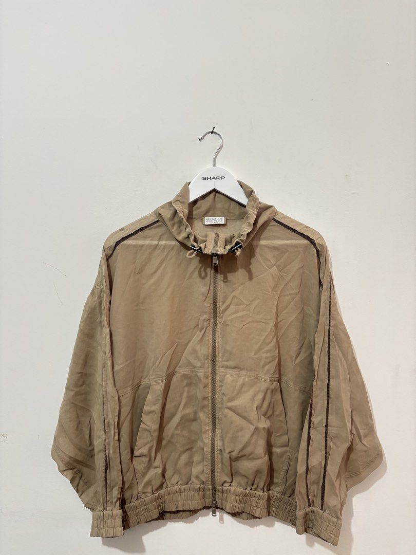 Brunello Cucinelli (Category: Coats, Jackets and Outerwear) located in Manila. Submitted by kingblaize (Listing ID 1460492834, Image 1). Description: beige Brunello Cucinelli lightweight zip-up jacket featuring dark contrast piping along the shoulders and sleeves..