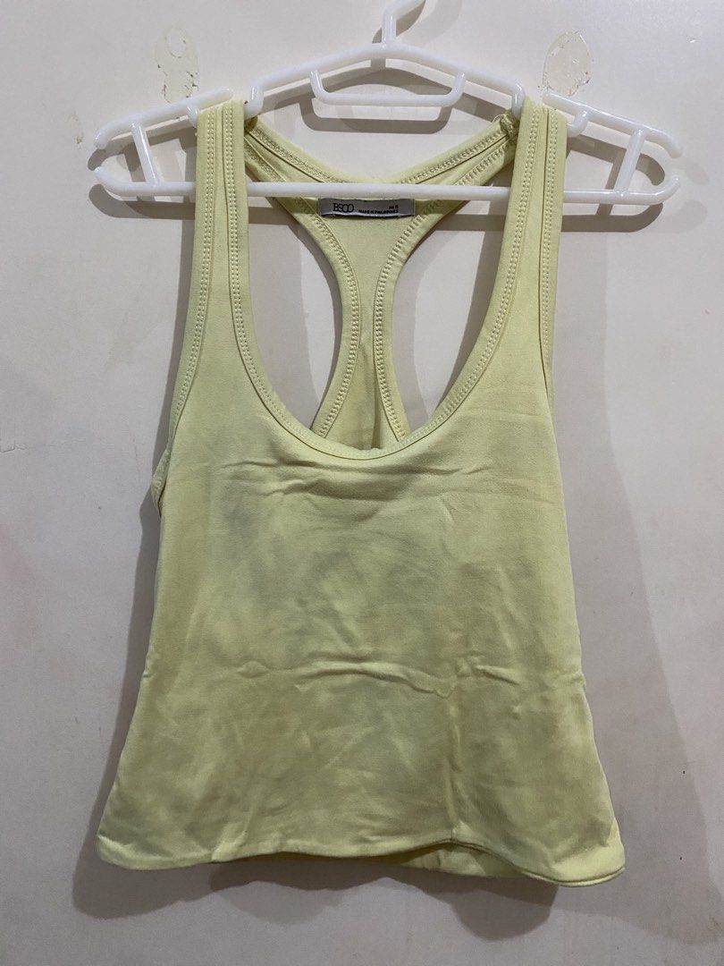 BSCO Yellow Racerback Tank Top (Category: Sleeveless) located in Taguig. Submitted by maly01_ (Listing ID 1460396363, Image 1). Description: - has a minir stain from recent laundry (see photos; may or may not be washable) dm for inquiries :).