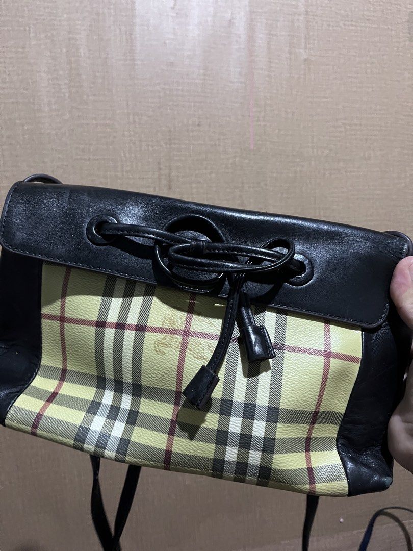 Burberry Nova Check Leather Drawstring Shoulder Bag (Category: Luxury Bags & Wallets) located in Manila. Submitted by madecuratedwithlove11 (Listing ID 1460476340, Image 1). Description: - Classic Burberry bag -Issue: Scratches, Rubs in each corner - Iconic Nova Check pattern - Black leather trim - Drawstring closure with leather ties - Interior leather brand tag - Snap button closure - Versatile shoulder bag for everyday use - Shows some signs o