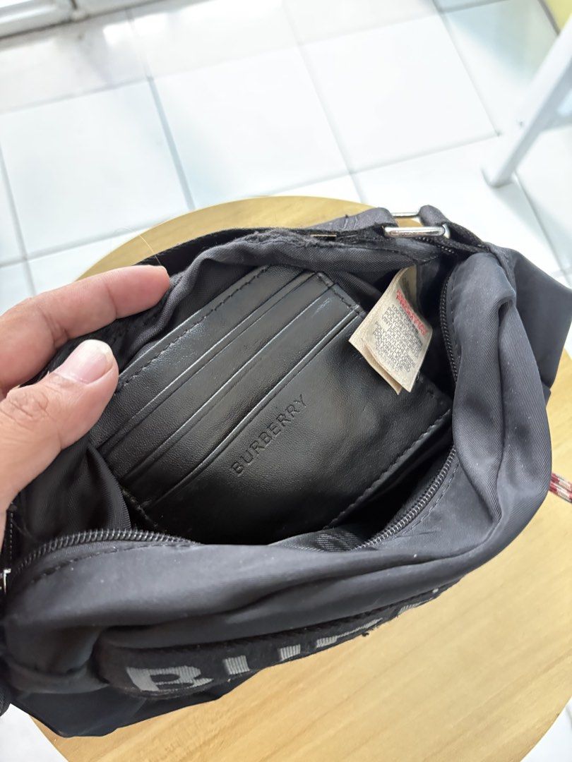 Burberry nylon sling bag (Category: Sling Bags) located in Batangas. Submitted by urbanhunter. (Listing ID 1460354833, Image 2). Description: Burberry nylon sling bag Issue: last pic (not noticeable since nasa loob) 2000 free shipping.