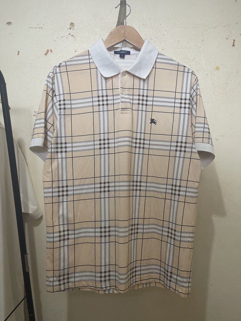 Burberry Plaid Polo Shirt (Category: Activewear) located in Tuguegarao City. Submitted by elyks11 (Listing ID 1460325092, Image 1). Description: GOODS PA NEED WASH SOLID PLAID RARE .