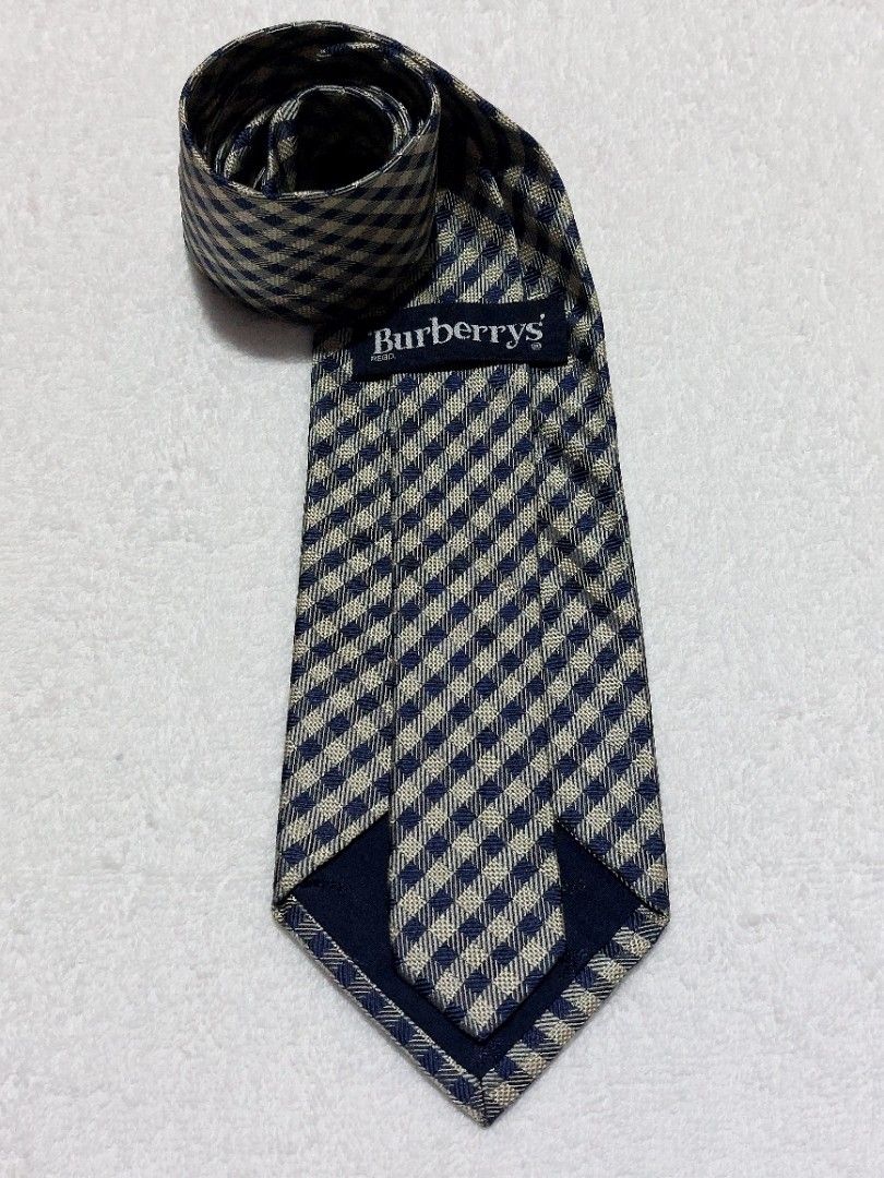 Burberry's Necktie 1 (Category: Luxury Apparel) located in Muntinlupa City. Submitted by sakurambo_des (Listing ID 1460480751, Image 1). Description: Vintage Burberry's Necktie Color: Classic Navy Blue & White in Gingham pattern in very good condition..