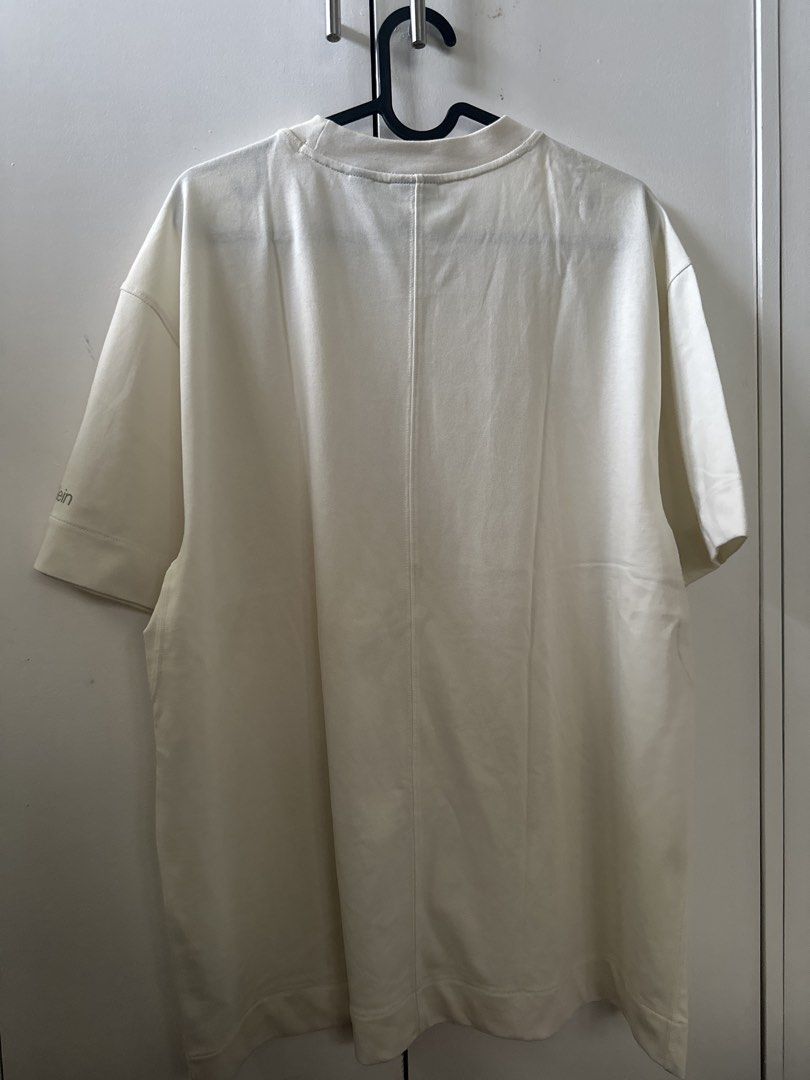 Calvin Klein Cream T-shirt (Category: Tshirts & Polo Shirts ) located in Mandaluyong City. Submitted by ayesesey (Listing ID 1460407040, Image 2). Description: - Cream Calvin Klein T-shirt - Size: Large (L) - Features Calvin Klein logo printed on the sleeve - Made in Sri Lanka - Simple and classic design - Ideal for everyday wear - With stain due to storage in the closet, but never been used.