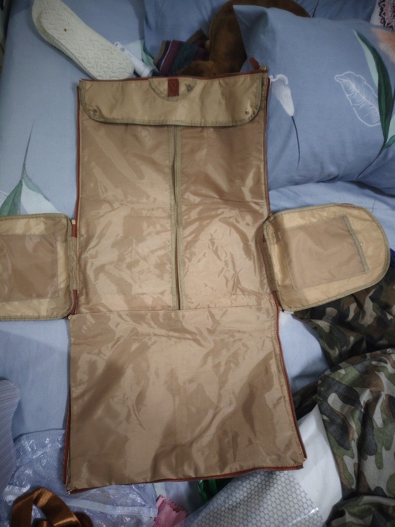 Canvas & Leather Duffle Bag with Garment Bag (Category: Tote Bags) located in Quezon City. Submitted by claudinen70390 (Listing ID 1460491739, Image 3). Description: - Stylish cream canvas duffle bag with elegant brown leather accents. - Ideal for weekend trips and travel. - Features a convenient separate garment bag that folds out. - Spacious dimensions: 52cm (L) x 25cm (W) x 32cm (H). - Versatile carrying options with a shoulder strap and top h