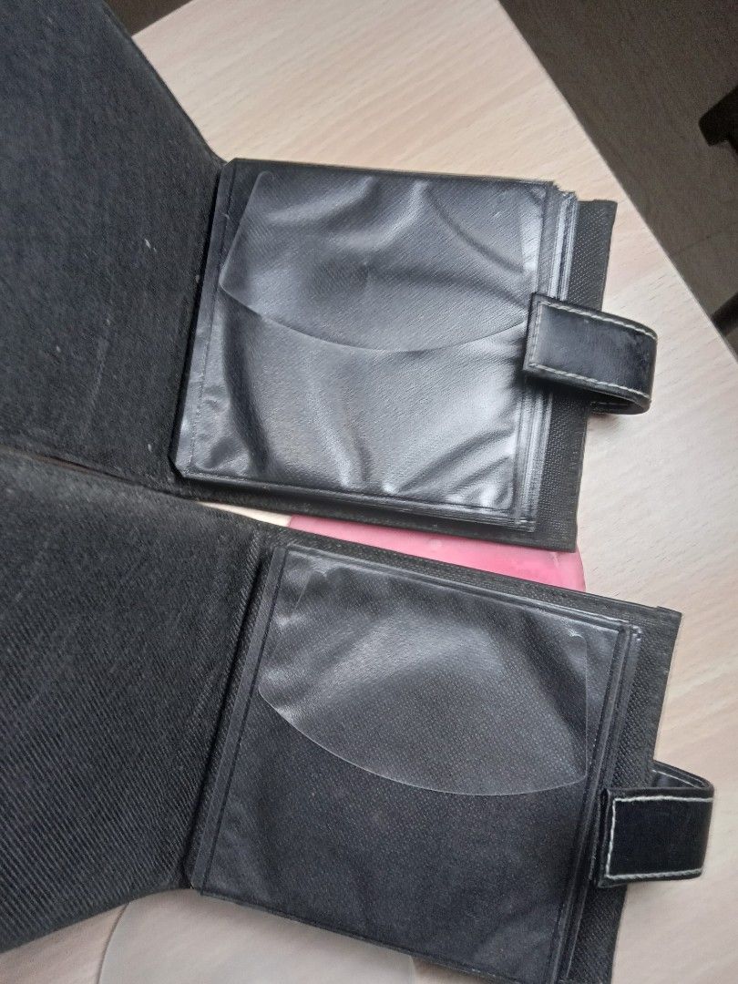 CD Organizers|Case Logic Black CD Wallet with CD Sleeves (Category: CDs & DVDs) located in San Fernando. Submitted by _luxielleph (Listing ID 1460492865, Image 2). Description: - Set of 2 black Case Logic CD wallets - Each wallet features multiple clear sleeves for CD storage - Includes 2 bonus CD sleeves: 1 pink, 1 frosted white - Ideal for organizing and protecting your CD collection - Keep your discs tidy and safe.