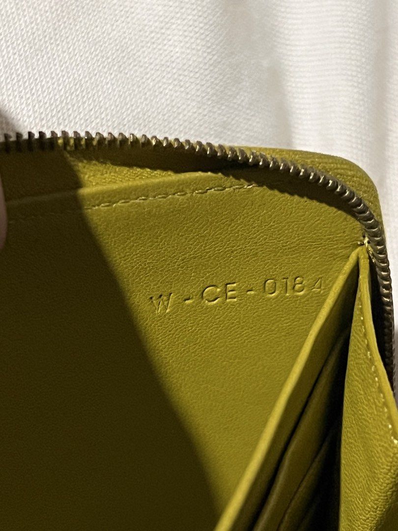 Celine Paris Leather Zip Around Wallet (Category: Luxury Bags & Wallets) located in Manila. Submitted by mightylion-ce6ea7 (Listing ID 1460442288, Image 3). Description: - Authentic Celine Paris zip-around wallet - Stylish two-tone design: Olive Green & Navy Blue - Genuine leather interior with multiple card slots and compartments - Expertly crafted in Italy - Minor signs of wear on exterior corners and edges - Zipper operates smoothly.