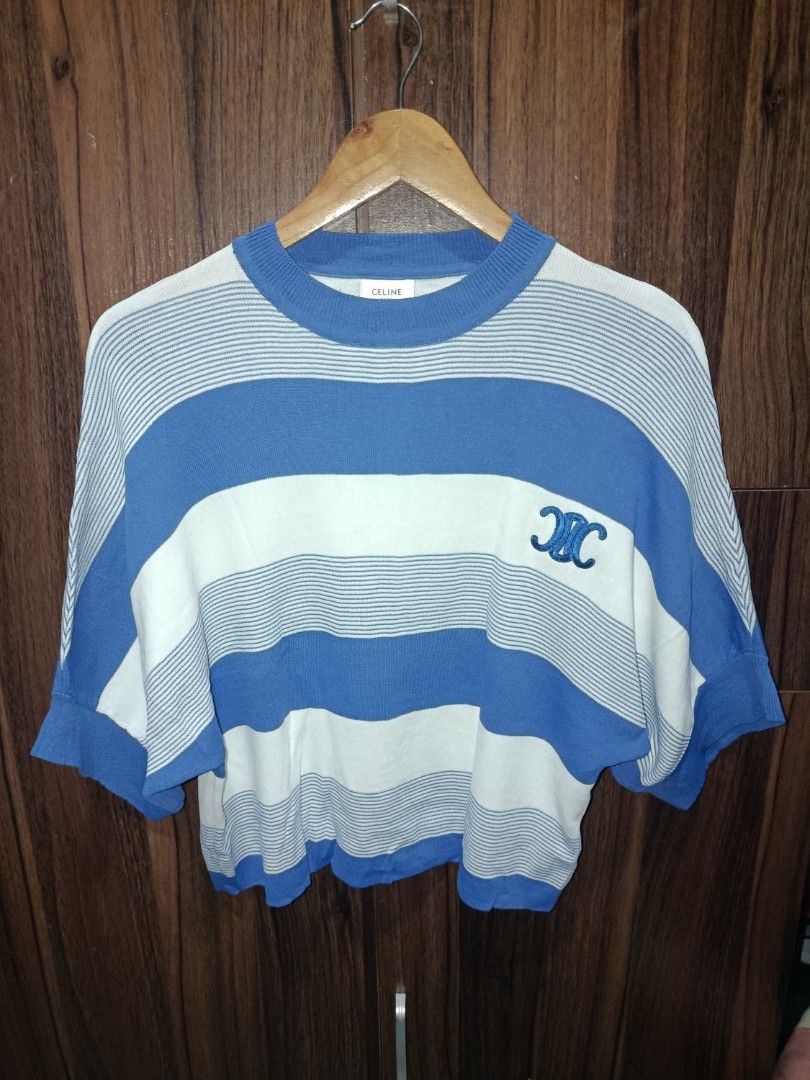 Celine Paris Striped Knit Sweater Top (Category: Longsleeves) located in Binangonan. Submitted by aj081718 (Listing ID 1460507129, Image 2). Description: - Celine Paris blue and white striped knit sweater - Iconic Triomphe logo embroidered on chest - Made in Italy - 100% Cotton - Size S - Measurements: 21" length, 22" width - Ideal for a casual and stylish look.