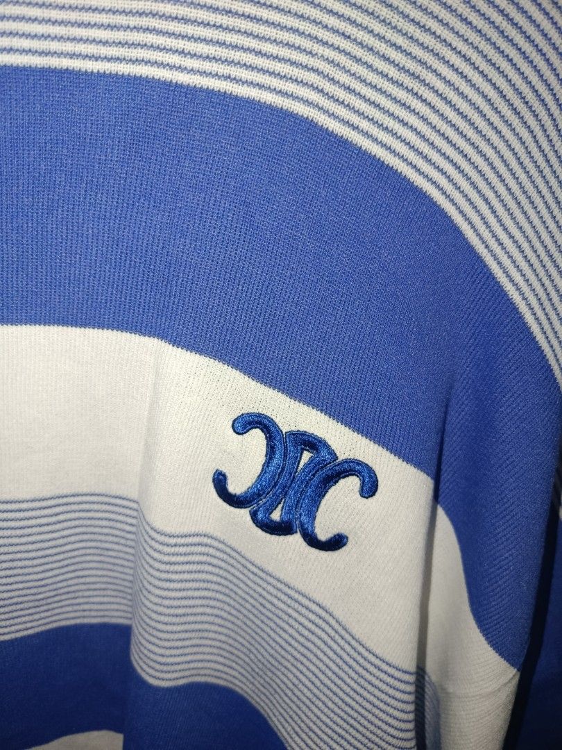 Celine Paris Striped Knit Sweater Top (Category: Longsleeves) located in Binangonan. Submitted by aj081718 (Listing ID 1460507129, Image 3). Description: - Celine Paris blue and white striped knit sweater - Iconic Triomphe logo embroidered on chest - Made in Italy - 100% Cotton - Size S - Measurements: 21" length, 22" width - Ideal for a casual and stylish look.