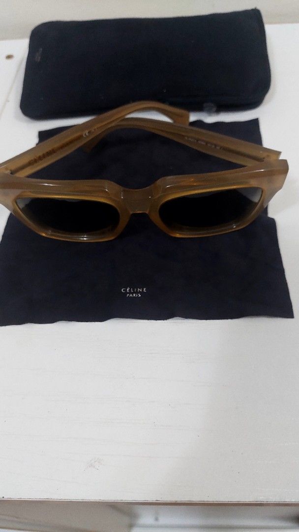 Celine Paris Sunglasses with Pouch (Category: Sunglasses & Eyewear) located in Manila. Submitted by aabila (Listing ID 1460425319, Image 3). Description: - Celine Paris sunglasses - Translucent brown frames - Comes with blue Celine Paris pouch - Ideal for sunny days - A stylish addition to your accessory collection.
