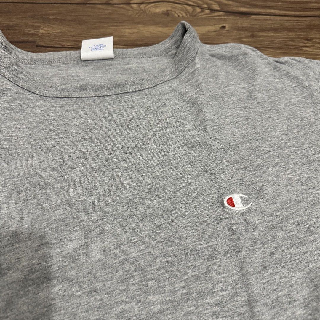 Champion gray shirt (Category: Tshirts & Polo Shirts ) located in Bulacan. Submitted by itemsbyjj (Listing ID 1460437403, Image 1). Description: Issue: white line stain.