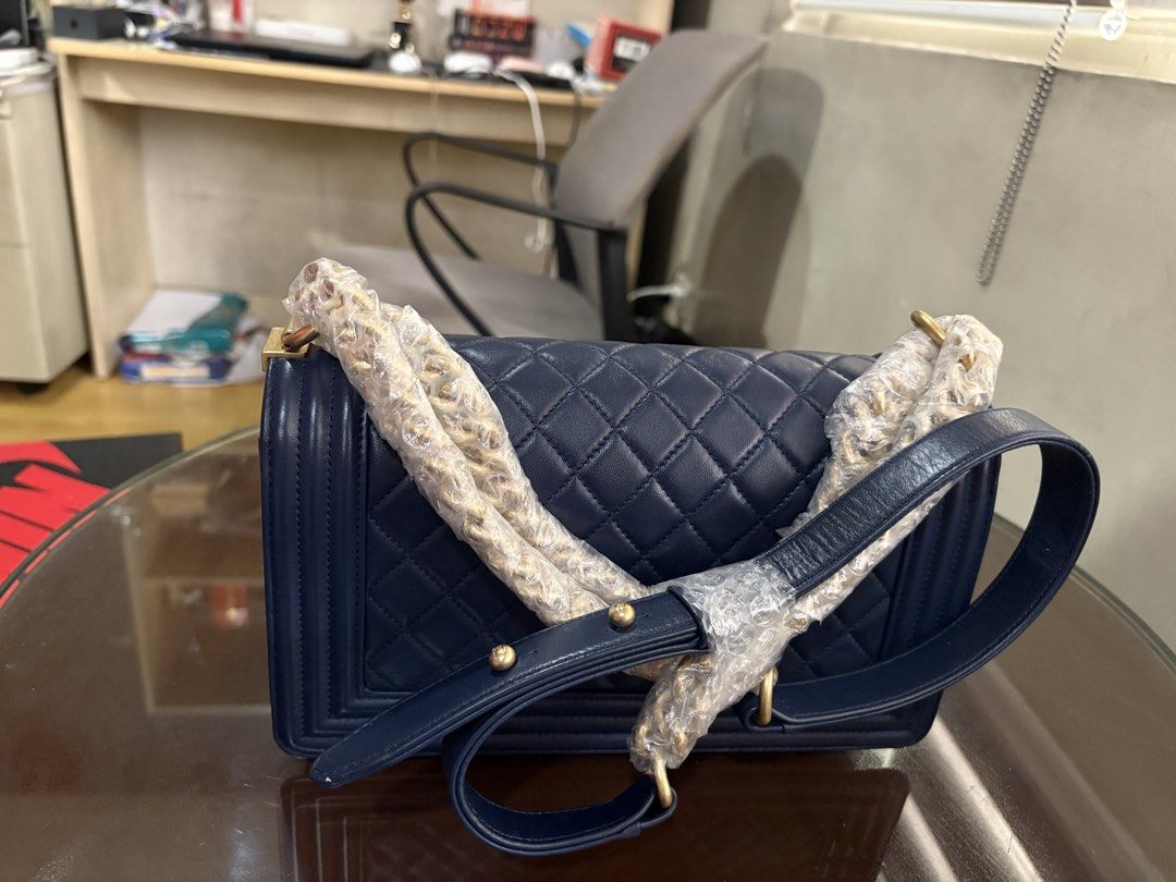 Chanel Le Boy Lamb Skin (Category: Purses & Pouches) located in Pasay City. Submitted by enzopeco (Listing ID 1460332733, Image 3). Description: Selling for my aunt Chanel Le Boy Lamb Skin Old Medium Blue and Gold Hardware In great condition (use photos as reference) Complete with certification, booklets, dustbag and box 190,000 (Slightly negotiable) Message for serious inquiries.
