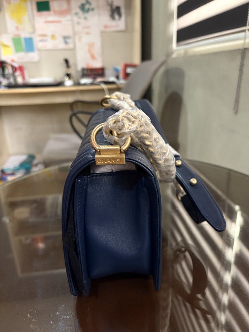 Chanel Le Boy Lamb Skin (Category: Purses & Pouches) located in Pasay City. Submitted by enzopeco (Listing ID 1460332733, Image 2). Description: Selling for my aunt Chanel Le Boy Lamb Skin Old Medium Blue and Gold Hardware In great condition (use photos as reference) Complete with certification, booklets, dustbag and box 190,000 (Slightly negotiable) Message for serious inquiries.