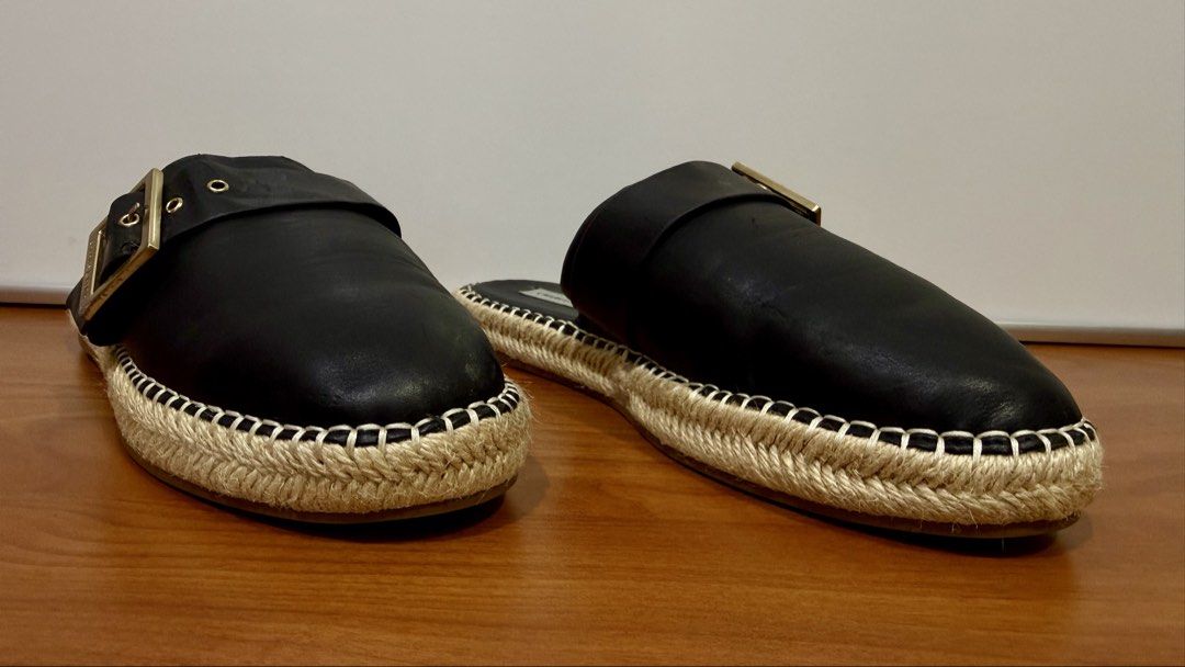 Charles & Keith Black Espadrille Mules (Category: Slippers and slides) located in Binangonan. Submitted by c_r_i_s (Listing ID 1460463911, Image 2). Description: Charles & Keith Black Espadrille Mules Women’s Size 38 and may fit Size 37 Stylish black slip-on mules featuring oversized gold-tone buckles and woven espadrille platform soles. Comfortable, versatile, and easy to pair with casual or smart-casual outfits. * Size: EU 38 * Color: Black * B