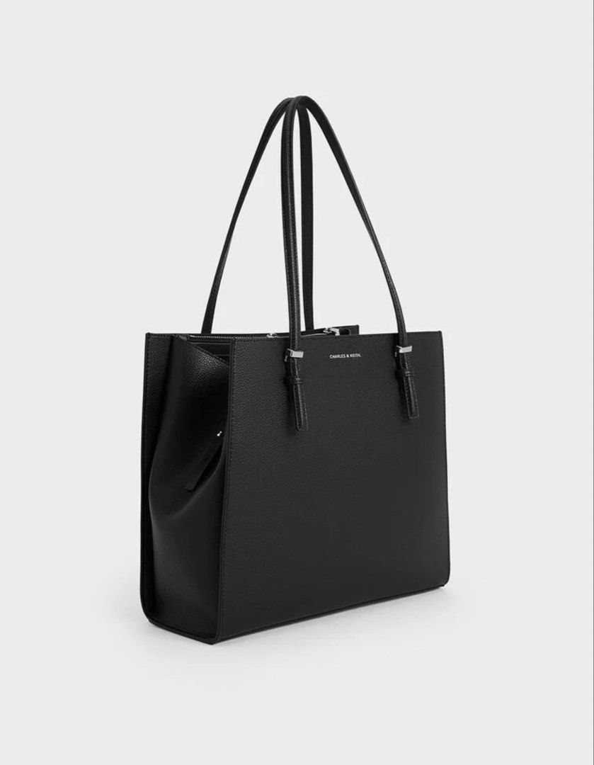 Charles & Keith Sansa Tote Bag - Noir (Category: Shoulder Bags) located in Paranaque City. Submitted by wearbymichelle (Listing ID 1460333899, Image 2). Description: - XL - Black - Has 3 compartments - Adjustable strap - Width: 35 cm - Depth: 12 cm - Height: 30 cm RFS: no longer being used.