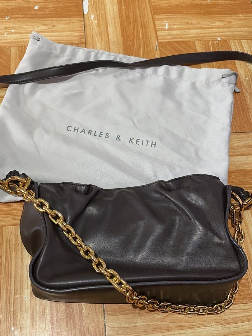 Charles and Keith Choco Brown Body Bag (Category: Cross-body Bags) located in Manila. Submitted by yourclosetmnl_ (Listing ID 1460384174, Image 1). Description: barely used.