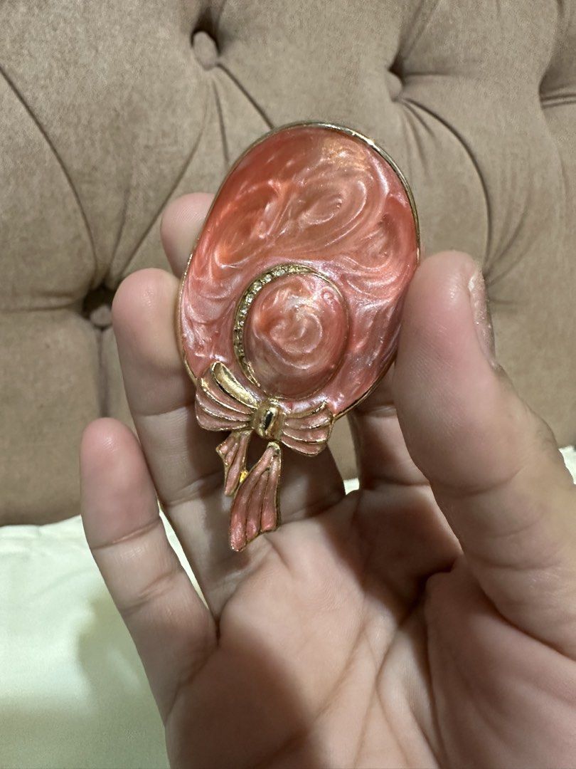 charming hat-shaped brooch (Category: Brooches) located in Davao. Submitted by favoritepreloved (Listing ID 1460485546, Image 1). Description: 💜 featuring a marbled pink enamel finish and a dainty gold-tone bow accent. .