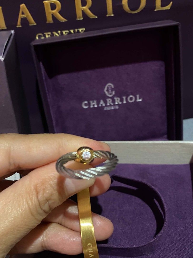 Charriol Geneva Infinity Zen Bangle with Diamond (Category: Bracelets) located in General Trias. Submitted by newberg0211 (Listing ID 1460448610, Image 2). Description: - Authentic Charriol Geneva Infinity Zen Bangle - Elegant gold finish with signature twisted cable design - Features a sparkling diamond accent - Comes with original box and authenticity card - Model Reference: 04-104-1252-03.
