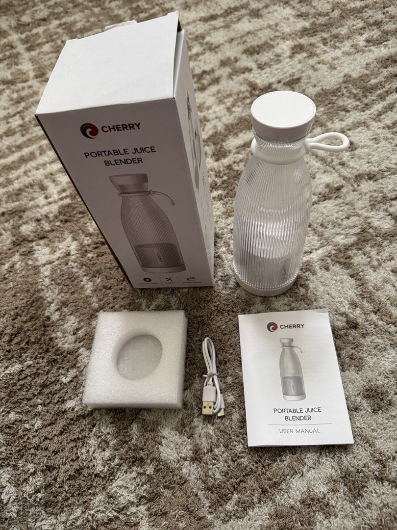 Cherry Portable Juice Blender JB01 White 300ml (Category: Juicers, Blenders & Grinders) located in Las Pinas. Submitted by vanethneth (Listing ID 1460411003, Image 1). Description: - Cherry Portable Juice Blender (Model JB01) - Color: White - Capacity: 300ml - Rechargeable with 1200mAh battery - Powerful 4 stainless steel blades - Auto-off safety feature - Includes USB charging cable and user manual - Ideal for making fresh juices on the go.