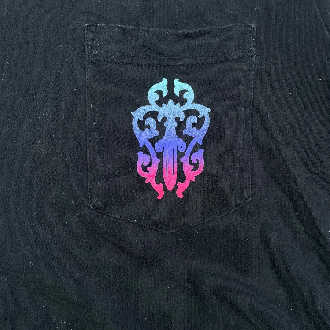 Chrome Hearts - Vintage Gradient Multicolor Dagger Pocket Shirt (Category: Tshirts & Polo Shirts ) located in Los Banos. Submitted by declutterking (Listing ID 1460482096, Image 3). Description: Size Small on tag • gradient dagger design • pocket on left chest • small logos on sleeve and back Dimensions: 16" shoulders 18" chest 26.25" length 7.75" sleeves Used condition.