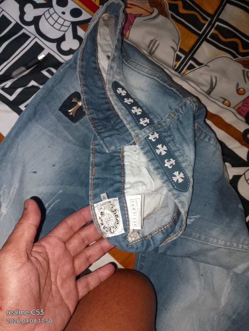 Chrome Hearts Style Denim Jeans (Category: Jeans) located in San Jose. Submitted by aickozero314322 (Listing ID 1460461774, Image 1). Description: - Light wash denim jeans - Distressed details and patches for a unique look - Eye-catching cross embellishments on the waistband - Classic straight leg fit - Ideal for everyday casual wear.