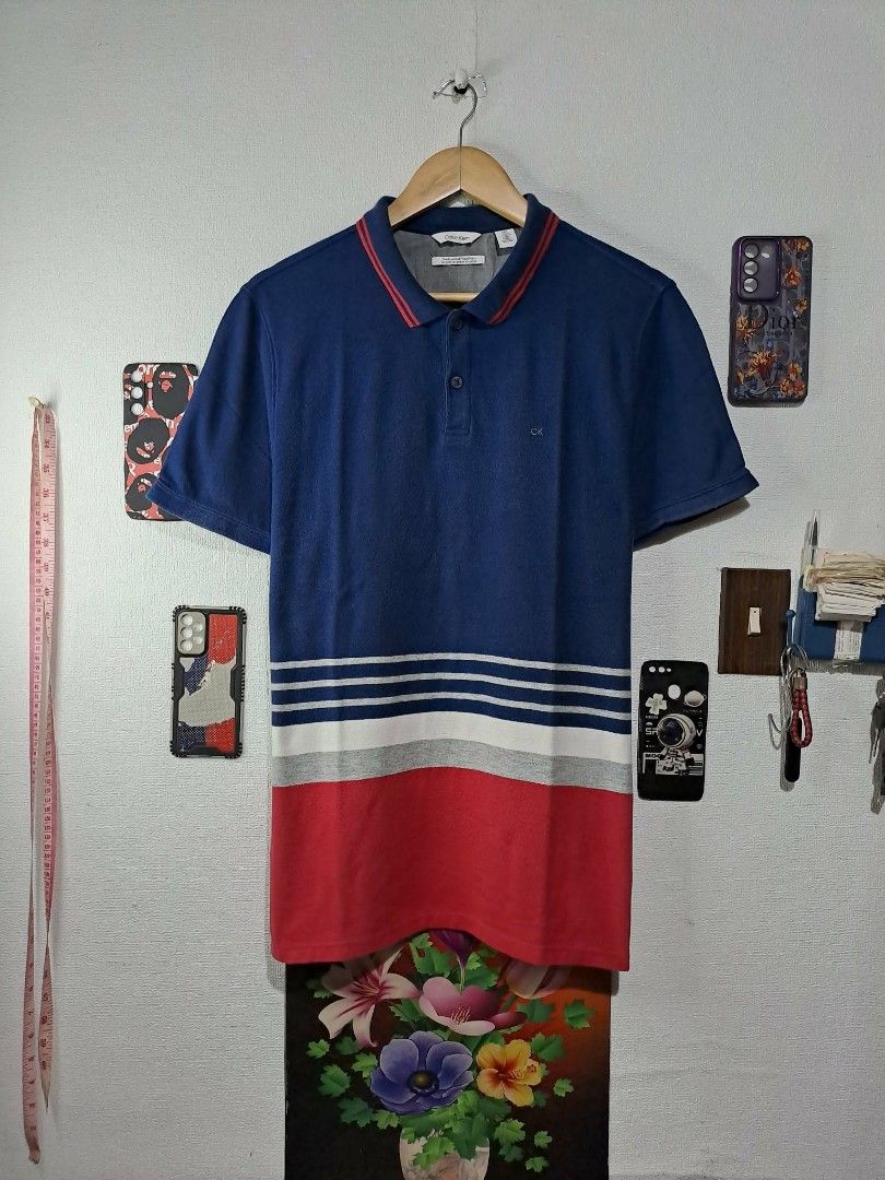 CK Calvin Klein Multi-Color (Category: Tshirts & Polo Shirts ) located in Quezon City. Submitted by yaseen73 (Listing ID 1460337018, Image 1). Description: Calvin Klein CK Multi - Color Minimalist Embroidery Polo Shirt Sued Cotton Color : Navy Blue/White/Grey Wearing Size : Medium Color Rate : 9.5/10 Dimensions : See Photo - With Minimal Sign of Usage - In Excellent Condition Free Shipping Via J&T Express Around Metro Manila MOP : gcash Seller's 