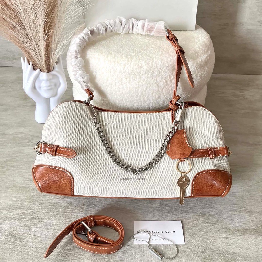 C&K Delfina Canvas Chain Side-Belt Shoulder Bag (Category: Shoulder Bags) located in Bulacan. Submitted by mykakarizza (Listing ID 1460504123, Image 2). Description: NEW✨✨ ₱950 onlyy C&K Delfina Canvas Chain Side-Belt Shoulder Bag Width 29 cm Depth 10.5 cm Height 14 cm Add paperbag 100 📸 Actual pics! 🙋🏻‍♀️ ─── ✦ ─── ✦ ─── ✦ ─── ✦ ─── 🛍️ LOOKING FOR MORE RESELLERS 🛍️ ✨ Buy 3 pcs of ANY items — FREE SHIPPING NA!🚚 ✨ Buy 10 items → FREE SF + ₱5