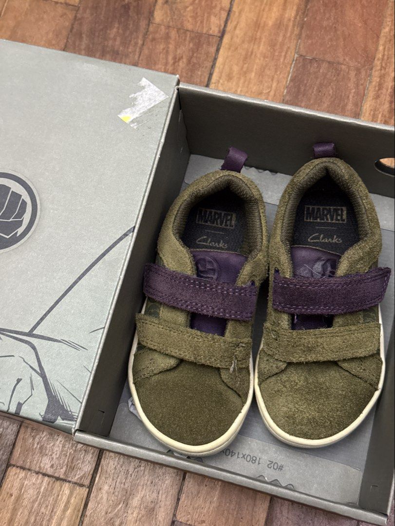 Clarks Marvel Toddler Shoes (Category: Babies & Kids Fashion) located in Angeles City. Submitted by holyfabclothing (Listing ID 1460418265, Image 2). Description: These are the Clarks x Marvel City Hero Lo toddler sneakers in olive green suede with purple Velcro straps. 13cm insole.