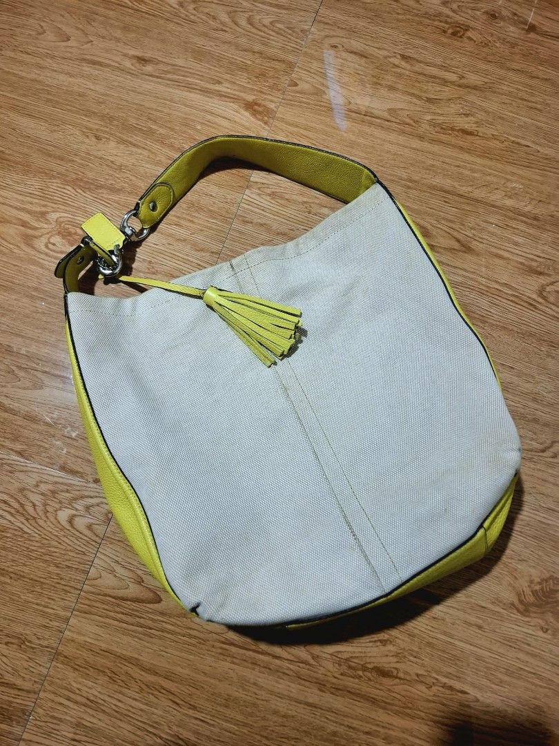 Coach Avery Hobo Bag (Free SF) (Category: Luxury Bags & Wallets) located in Baguio. Submitted by bycharmaebuys (Listing ID 1460460993, Image 2). Description: Coach Avery hobo bag Guaranteed Authentic 💯 NOT UKAY, PERSONAL PRELOVED ‼️ SALE PRICE: 1500.00, FREE SHIPPING NATIONWIDE‼️ Orig Price: 3000.00 First to pay basis Dimension: 13" by 12" Canvas material with Leather Trimmings Natural canvas with lemon yellow color Silver hardware Magnetic Snap