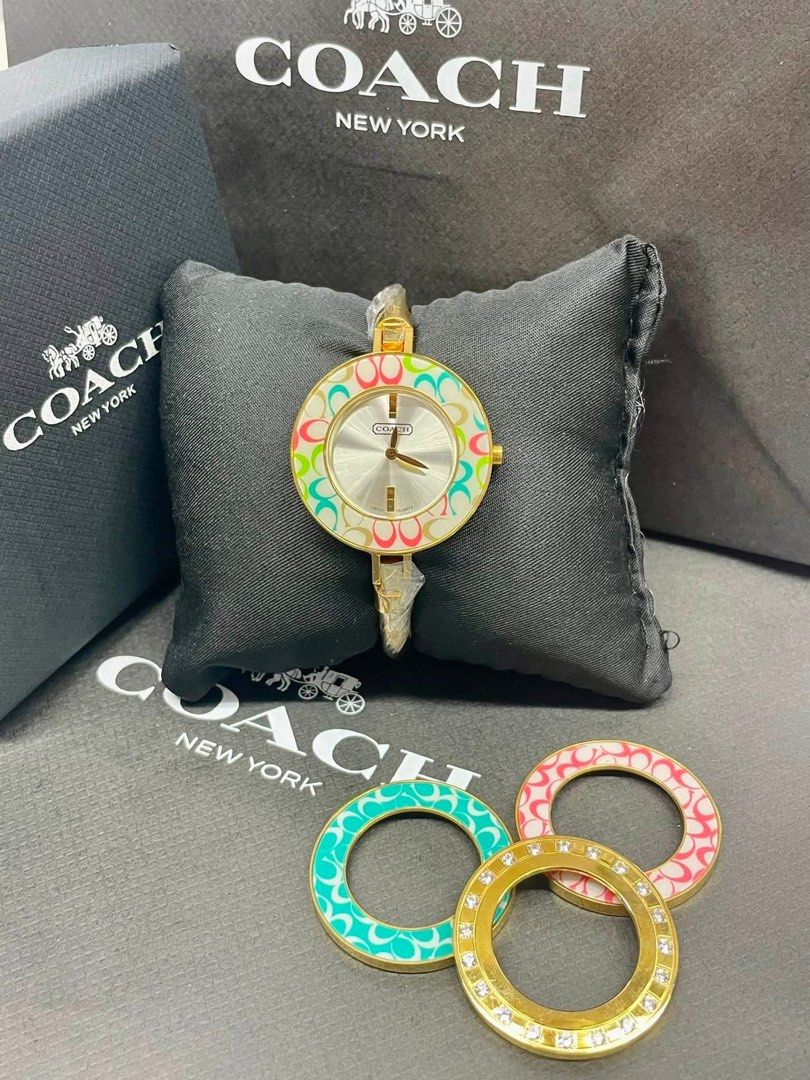 Coach bangle watch interchangeable bezel (Category: Women's Watches) located in Manila. Submitted by thriftmaaa (Listing ID 1460503578, Image 2). Description: Coach bangle watch interchangeable bezel -Gold details - 4 bezels included - with box and manual OG.