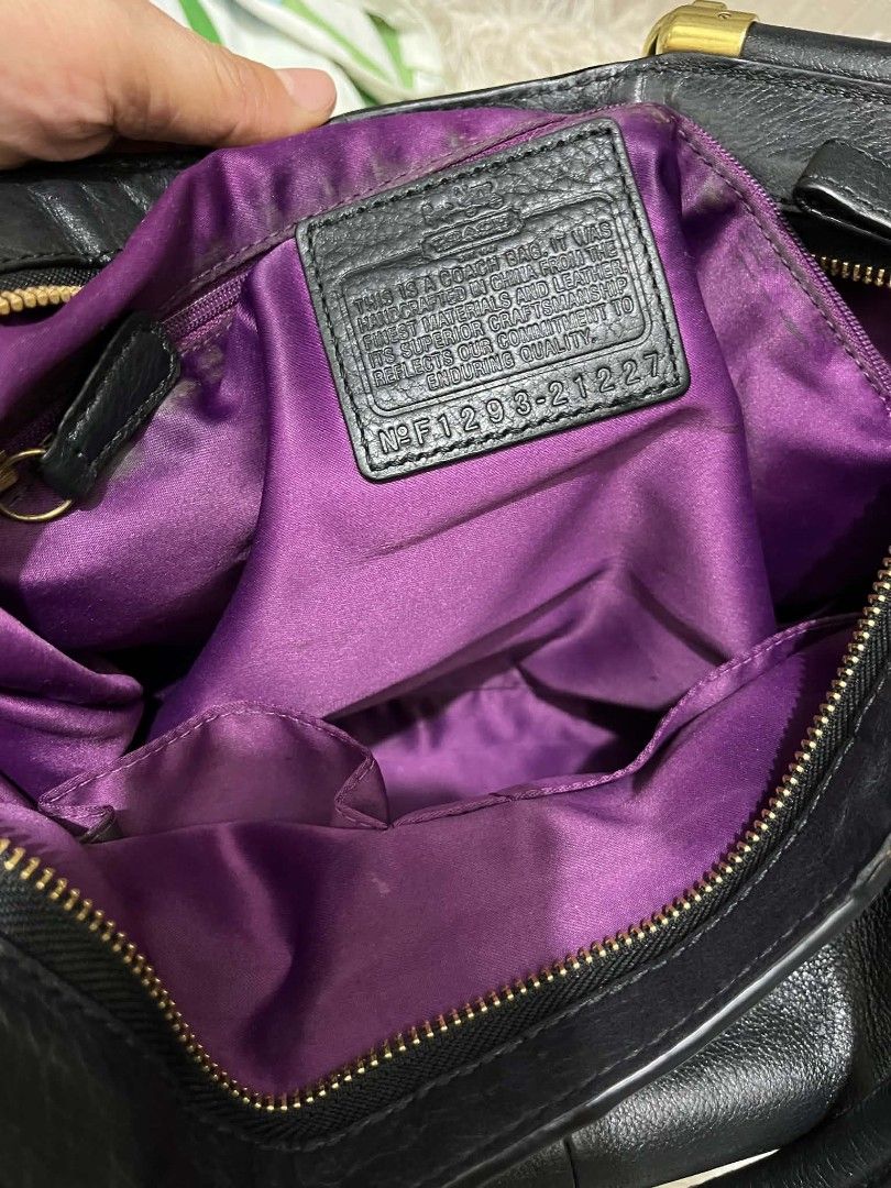 Coach Black Leather Handbag (Category: Shoulder Bags) located in Imus. Submitted by desvasquez (Listing ID 1460350858, Image 3). Description: - Genuine black leather Coach handbag - Elegant gold hardware accents - Luxurious purple satin interior lining - Spacious design, perfect for everyday use - Comes with original tag - excellent condition - med size - no flaws - guaranteed OG.