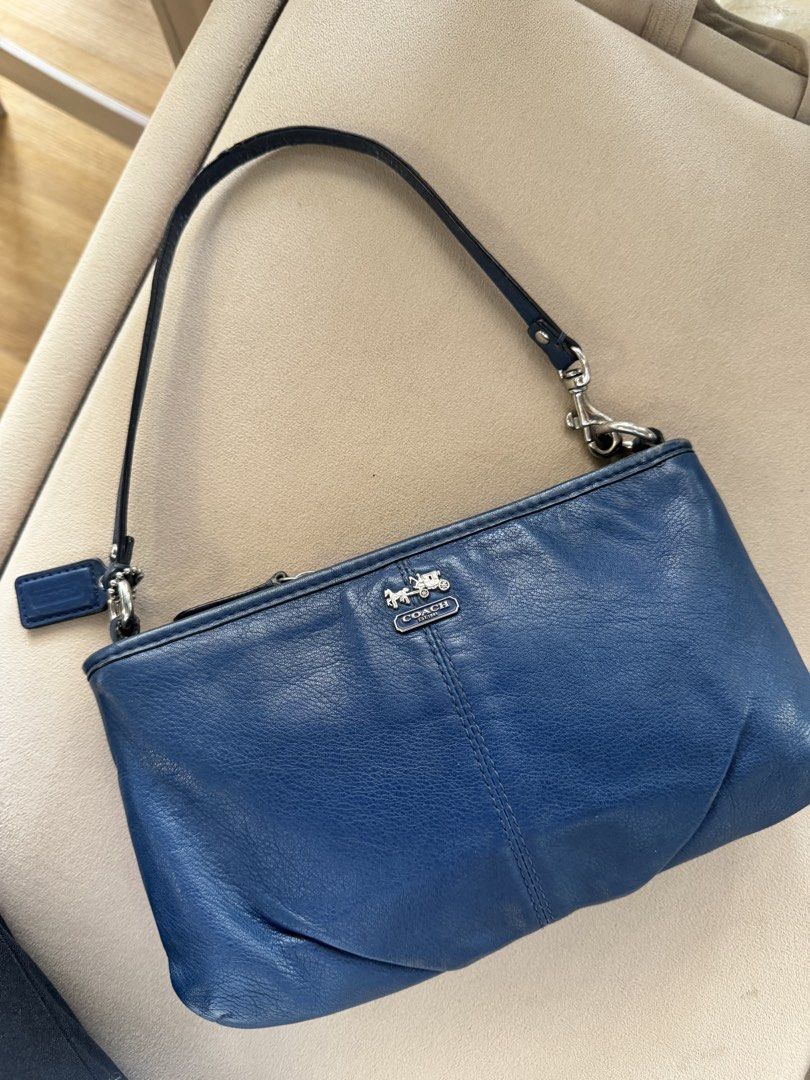 Coach Blue Leather Baguette (Category: Luxury Bags & Wallets) located in San Pedro. Submitted by kianacrngn (Listing ID 1460394036, Image 2). Description: - Authentic Coach blue leather wristlet - Embossed Coach logo on the front - Detachable strap with buckle closure - Convenient top zipper closure - Ideal for carrying your daily essentials.