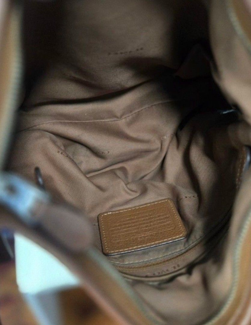 Coach Brown Leather Shoulder Bag (Category: Luxury Bags & Wallets) located in Quezon City. Submitted by affordabags_cd (Listing ID 1460422529, Image 3). Description: - Brand: Coach - Material: Brown pebbled leather - Closure: Zip top - Interior: Fabric lining with Coach branding patch - Origin: Made in Vietnam - Style: Great everyday shoulder bag.