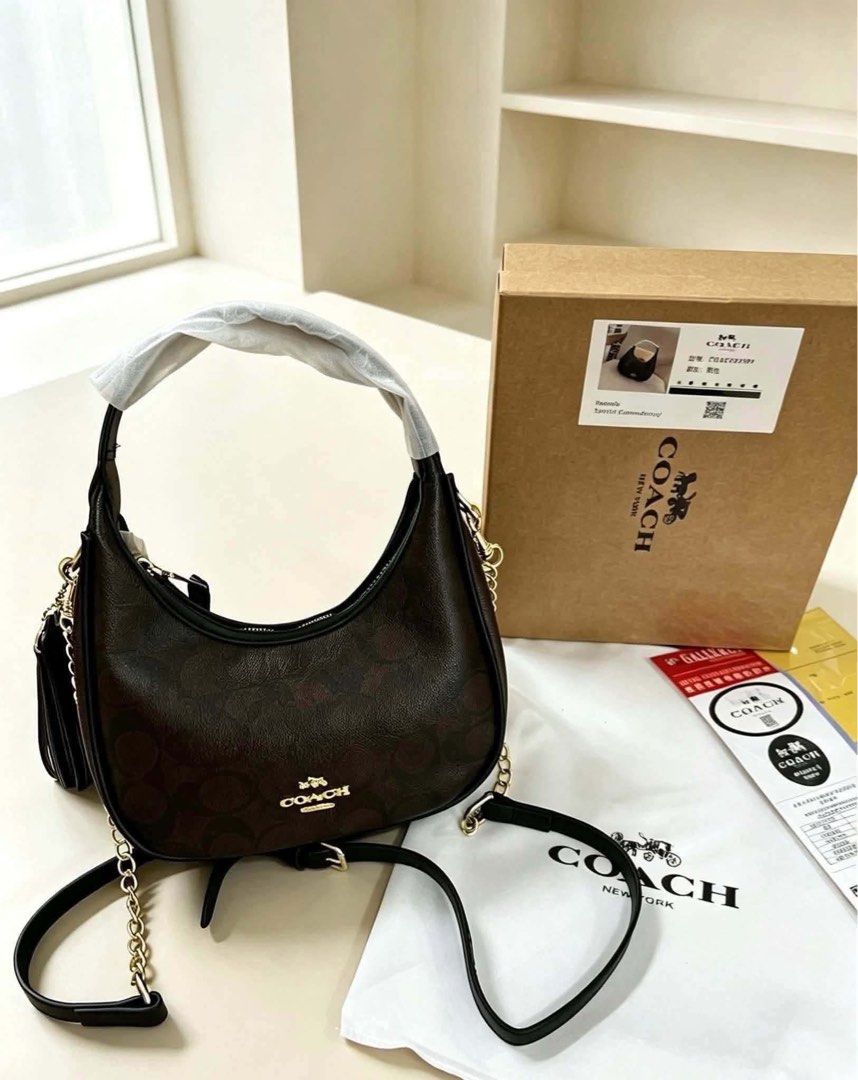 Coach Hobo Shoulder Bag (Category: Luxury Bags & Wallets) located in Manila. Submitted by lovely_girl18 (Listing ID 1460447609, Image 2). Description: - Authentic Coach Hobo Shoulder Bag - Includes original dust bag and box - Features elegant gold hardware - Comes with both a stylish chain strap and a comfortable leather strap - Chic tassel detail on the side - Versatile design, ideal for everyday use - Available in a variety of colors to suit yo