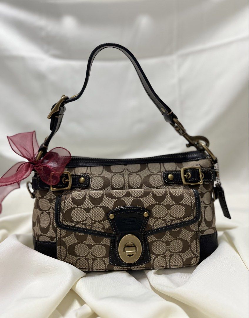 Coach Legacy (stripe lining inside🌈) (Category: Luxury Bags & Wallets) located in Quezon. Submitted by consulhann69386 (Listing ID 1460356085, Image 2). Description: - Classic Coach monogram shoulder bag - Turn-lock closure - Front pocket - Colorful striped interior lining - Leather trim and strap no issue- normal signs of wear only .