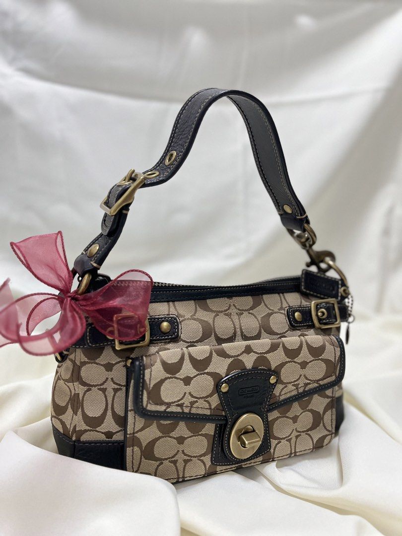 Coach Legacy (stripe lining inside🌈) (Category: Luxury Bags & Wallets) located in Quezon. Submitted by consulhann69386 (Listing ID 1460356085, Image 1). Description: - Classic Coach monogram shoulder bag - Turn-lock closure - Front pocket - Colorful striped interior lining - Leather trim and strap no issue- normal signs of wear only .