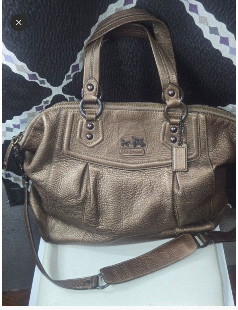Coach Metallic Leather Satchel Bag (Category: Luxury Bags & Wallets) located in Quezon City. Submitted by affordabags_cd (Listing ID 1460423265, Image 1). Description: - Genuine bronze metallic leather Coach satchel - Secure top zip closure - Comfortable double handles - Versatile detachable crossbody strap included - Interior features a zippered pocket and slip pockets for organization - Made in China - Ideal everyday bag.