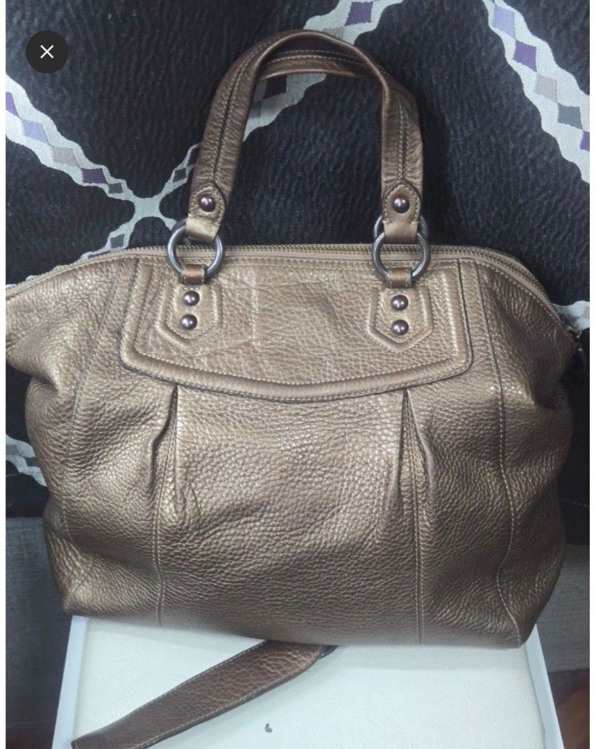 Coach Metallic Leather Satchel Bag (Category: Luxury Bags & Wallets) located in Quezon City. Submitted by affordabags_cd (Listing ID 1460423265, Image 2). Description: - Genuine bronze metallic leather Coach satchel - Secure top zip closure - Comfortable double handles - Versatile detachable crossbody strap included - Interior features a zippered pocket and slip pockets for organization - Made in China - Ideal everyday bag.