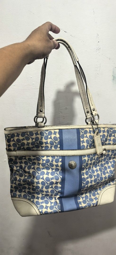 Coach Monogram Canvas & Leather Tote Bag (Category: Luxury Bags & Wallets) located in Abucay. Submitted by jerlynbal98316 (Listing ID 1460466132, Image 2). Description: - Classic Coach tote bag - Signature blue and cream monogram pattern - Genuine leather trim and handles - Stylish central stripe detail - Silver-tone hardware - Ample interior space for essentials - Ideal for everyday use.