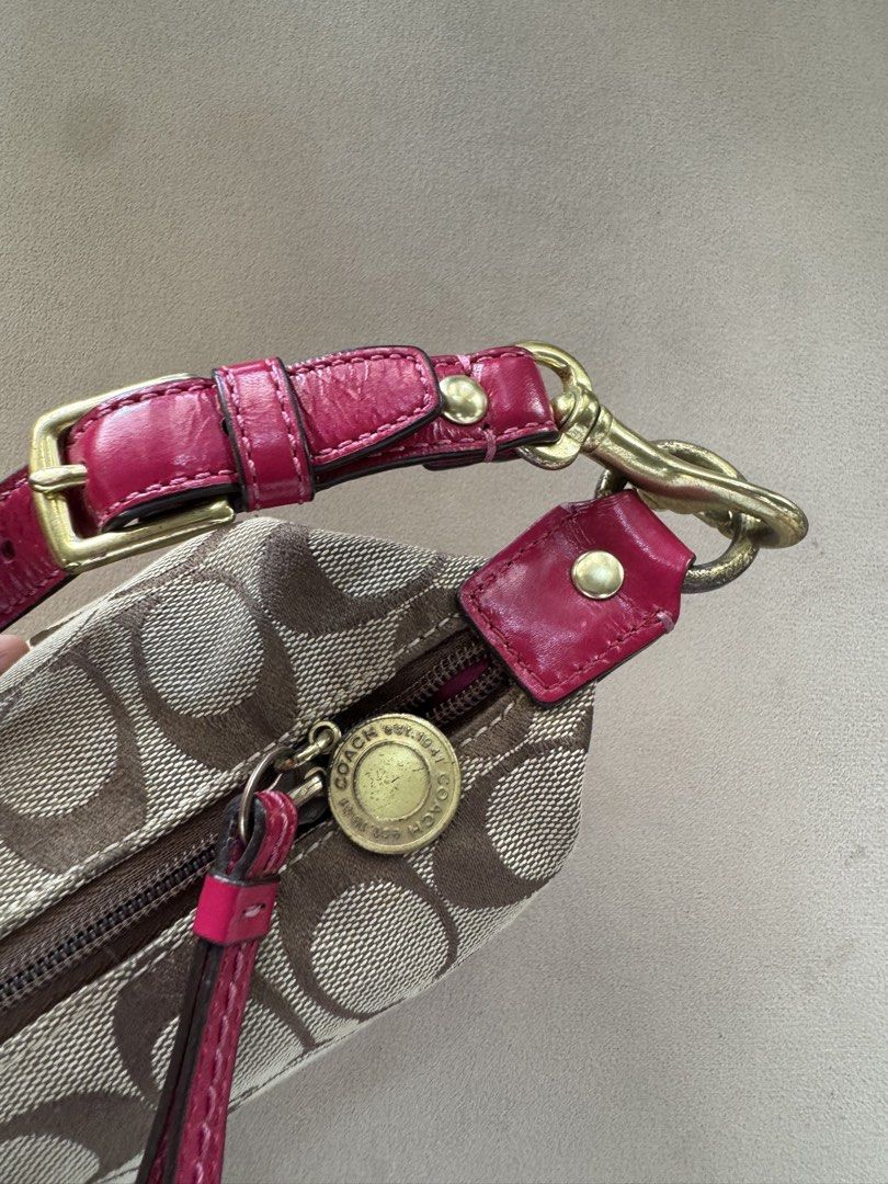 Coach Monogram Canvas & Pink Leather Shoulder Bag (Category: Luxury Bags & Wallets) located in San Pedro. Submitted by kianacrngn (Listing ID 1460395724, Image 3). Description: - Authentic Coach monogram shoulder bag - Stylish pink leather trim - Vibrant, colorful striped interior lining - Durable brass-toned hardware - Adorable beaded charm attached to the strap - Secure zipper closure - Interior features a Coach logo and serial number leather p