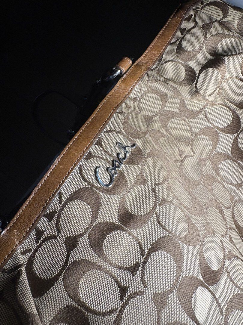 Coach Monogram Canvas Leather Trim Tote Bag (Category: Luxury Bags & Wallets) located in Cavite. Submitted by xandrastyl90775 (Listing ID 1460498625, Image 2). Description: - Classic Coach tote bag - Signature monogram pattern - Brown leather trim and handles.
