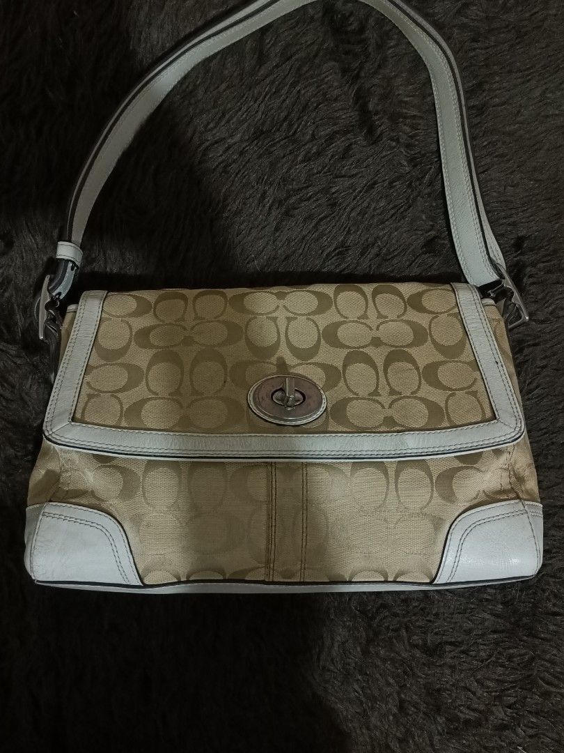 Coach Monogram Shoulder Bag (Category: Luxury Bags & Wallets) located in Manila. Submitted by altsells (Listing ID 1460468160, Image 1). Description: - Classic Coach monogram shoulder bag - Tan and cream canvas with light blue leather trim - Secure turn-lock closure - Adjustable shoulder strap - Spacious interior for essentials - Ideal for everyday use .