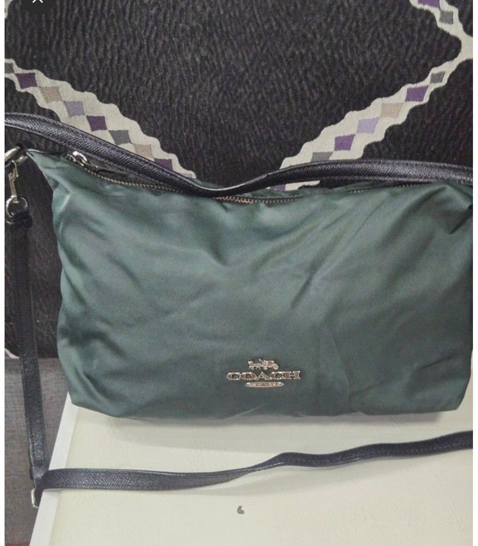 Coach Nylon Crossbody Bag Green (Category: Other Accessories) located in Quezon City. Submitted by affordabags_cd (Listing ID 1460426282, Image 1). Description: - Authentic Coach green nylon crossbody bag - Features stylish leather trim and strap - Secure zipper closure - Signature metal hardware with Coach logo - Proudly made in the Philippines - Ideal size for carrying your daily essentials.