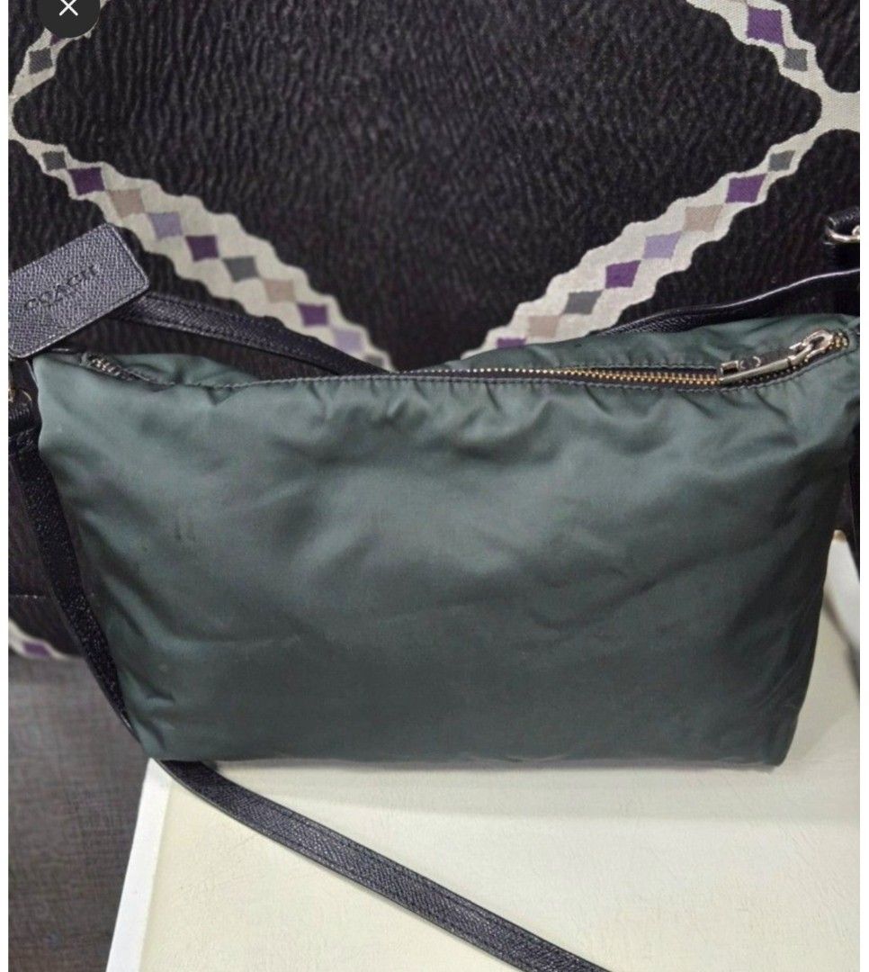 Coach Nylon Crossbody Bag Green (Category: Other Accessories) located in Quezon City. Submitted by affordabags_cd (Listing ID 1460426282, Image 2). Description: - Authentic Coach green nylon crossbody bag - Features stylish leather trim and strap - Secure zipper closure - Signature metal hardware with Coach logo - Proudly made in the Philippines - Ideal size for carrying your daily essentials.