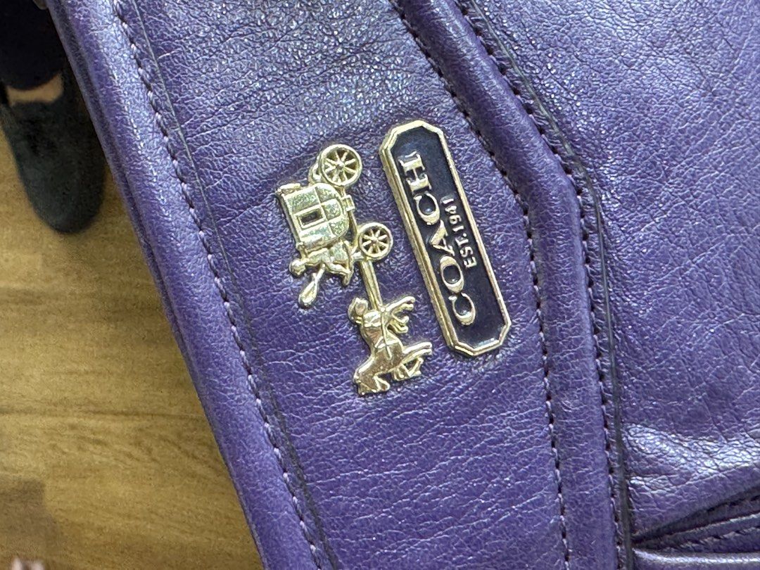 Coach Purple Leather Pouch with Gold Hardware (Category: Purses & Pouches) located in San Pedro. Submitted by kianacrngn (Listing ID 1460396271, Image 2). Description: - Authentic Coach pouch in vibrant purple - Genuine leather material - Secure zip closure - Interior slip pocket for organization - Elegant gold hardware, including Coach logo - Small tag attached - Ideal for keeping your essentials tidy.