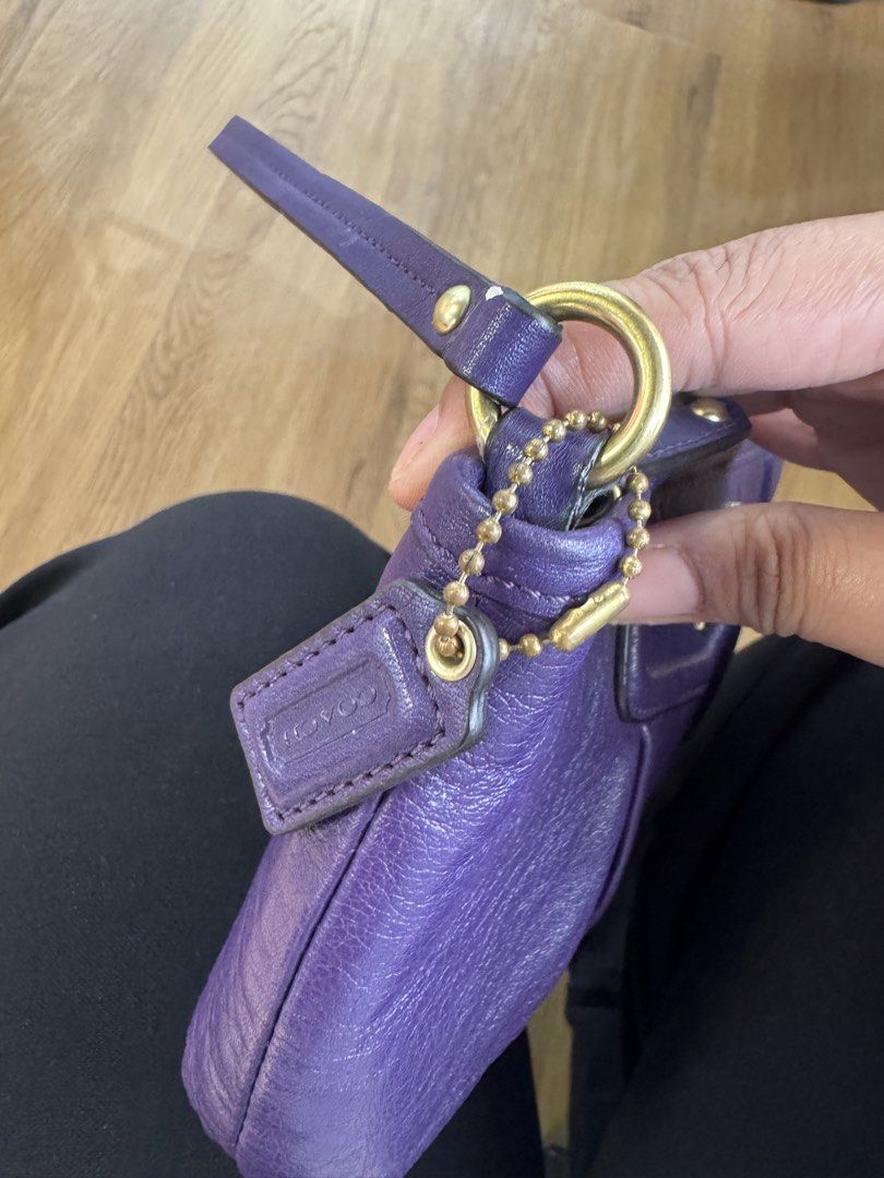 Coach Purple Leather Pouch with Gold Hardware (Category: Purses & Pouches) located in San Pedro. Submitted by kianacrngn (Listing ID 1460396271, Image 3). Description: - Authentic Coach pouch in vibrant purple - Genuine leather material - Secure zip closure - Interior slip pocket for organization - Elegant gold hardware, including Coach logo - Small tag attached - Ideal for keeping your essentials tidy.