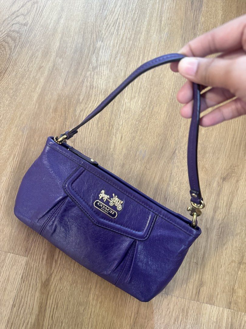 Coach Purple Leather Pouch with Gold Hardware (Category: Purses & Pouches) located in San Pedro. Submitted by kianacrngn (Listing ID 1460396271, Image 1). Description: - Authentic Coach pouch in vibrant purple - Genuine leather material - Secure zip closure - Interior slip pocket for organization - Elegant gold hardware, including Coach logo - Small tag attached - Ideal for keeping your essentials tidy.