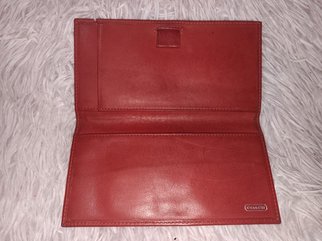 Coach Red Leather Long Wallet (Category: Wallets & Card holders) located in San Juan City. Submitted by swiftfox.62e2f4 (Listing ID 1460435733, Image 2). Description: - Authentic Coach red leather long wallet - Classic and timeless design - Ample space for cards and cash - Interior is clean and well-maintained - Shows some signs of wear, consistent with normal use - Still in good, functional condition - Ideal for everyday use.